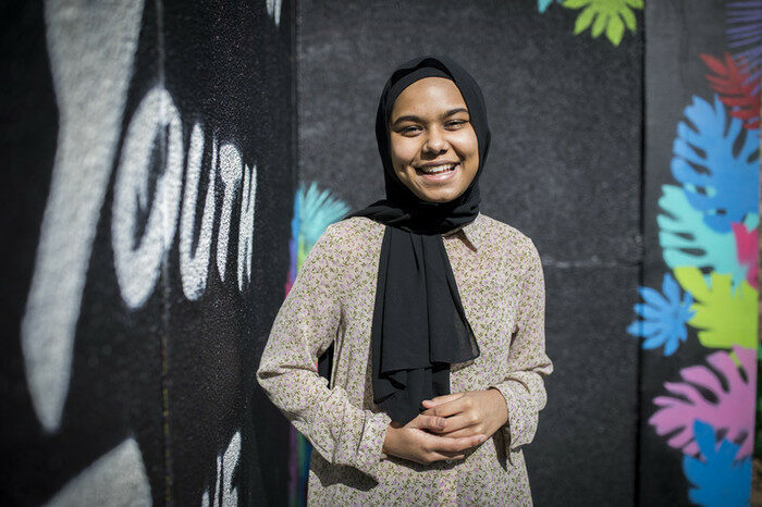 Young female participant smiling to camera